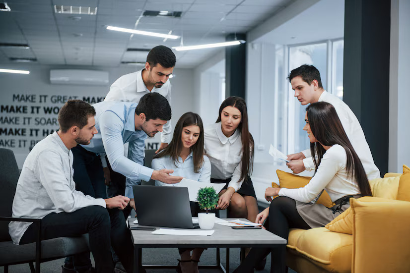 An employee points out a design flaw in a new product to the department manager